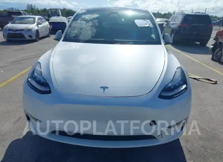 TESLA MODEL Y 2023 vin 7SAYGDEE2PA110084 from auto auction Iaai