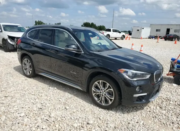 BMW X1 XDRIVE2 2017 vin WBXHT3C36H5F70414 from auto auction Copart