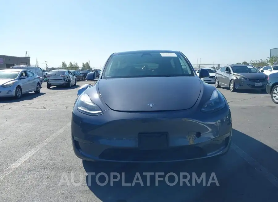 TESLA MODEL Y 2023 vin 7SAYGAEE9PF738841 from auto auction Iaai