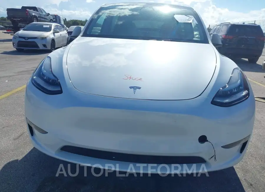 TESLA MODEL Y 2023 vin 7SAYGDEE2PA110084 from auto auction Iaai